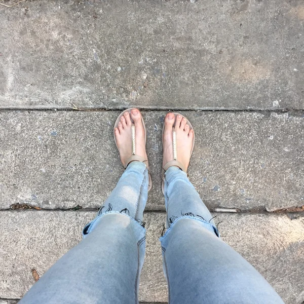 Bare feet and blue jeans Stock Photos, Royalty Free Bare feet and blue ...