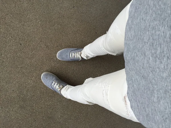 Gray Sneakers walking on floor — Stock Photo, Image