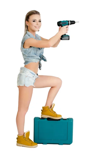 Beautiful young woman with a electric screwdriver — Stock Photo, Image