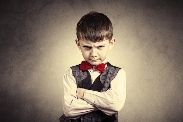 Stubborn,sad,upset  little boy,child  isolated over grey backgro — Stock Photo, Image