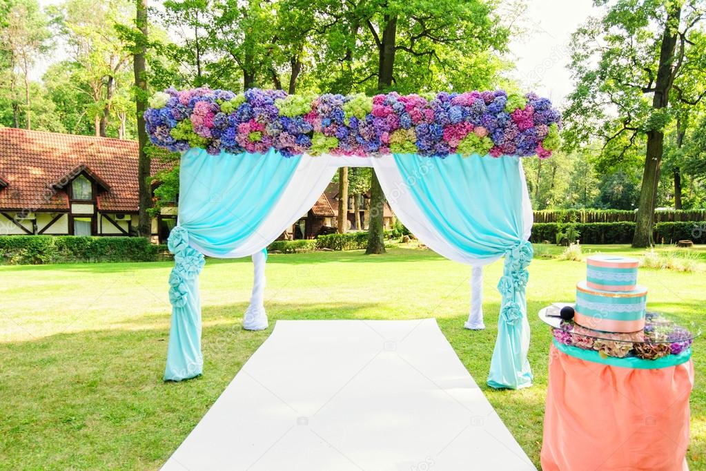 Colorful wedding arch with flowers