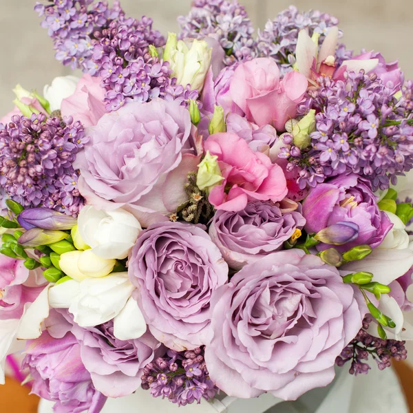 Flower composition with lilac and eustoma flowers — Stock Photo, Image