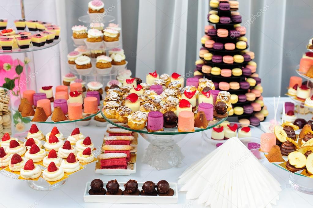 Dessert stand with a lot of delicious sweets