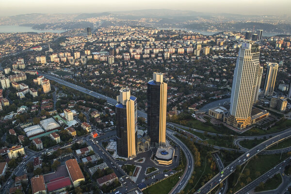 ISTANBUL, TURKEY - AUGUST 23: Skyscrapers and modern office buildings at Levent District. With Bosphorus background. August 23, 2014 in Istanbul, Turkey.