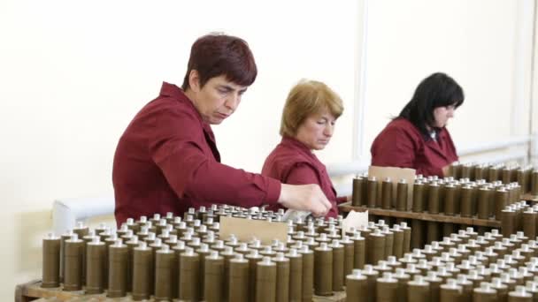 Workers checking RPG explosives in munition factory — Stock Video