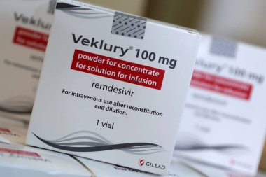 Sofia, Bulgaria - 29 October, 2020: Veklury remdesivir medication packs for the treatment of COVID-19 are seen in boxes before sent to hospitals in Bulgaria. clipart