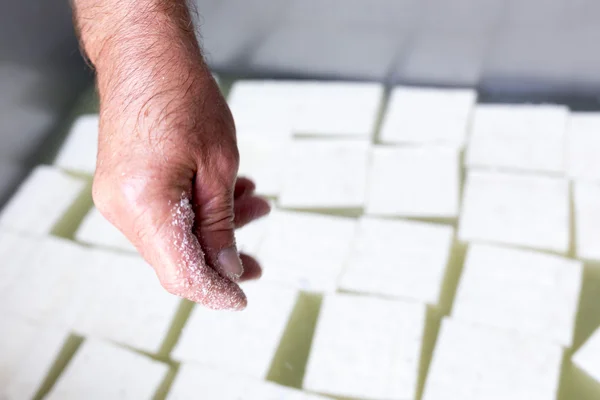 Bulgarian white feta cheese cubes salting — Stockfoto