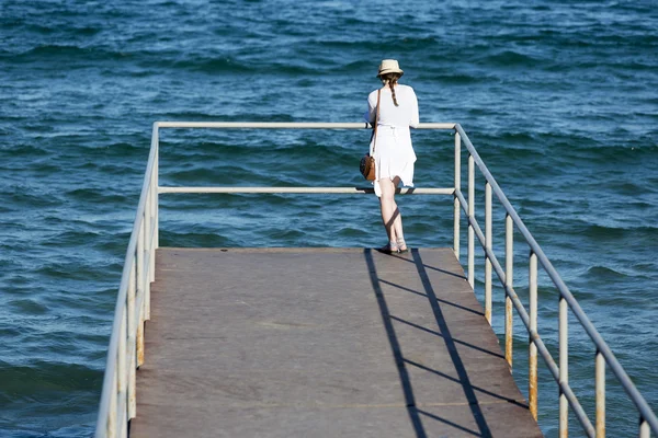 Young woman on the jetty — Stock Photo, Image