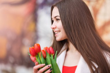 Attractive woman with tulips