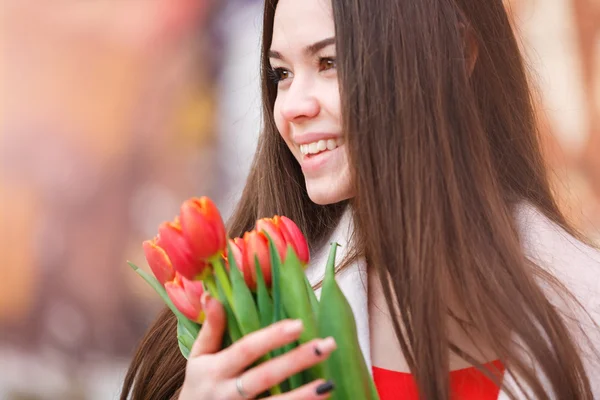 Attractive woman with tulips — Stok fotoğraf