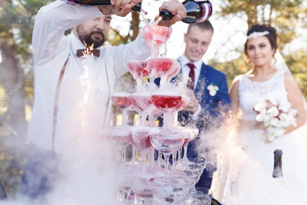 Show of bartender at wedding banquet Stock Photo by ©castenoid 119542236