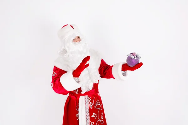 Santa Claus with a Christmas toy — Stock Photo, Image