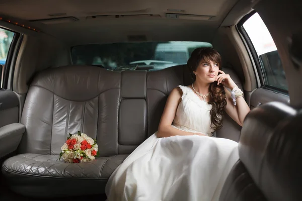 Bride looking in the window — Stock Photo, Image