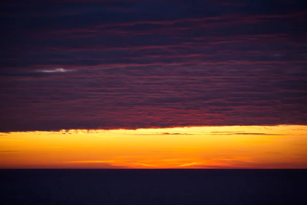 Zonsondergang en zee — Stockfoto