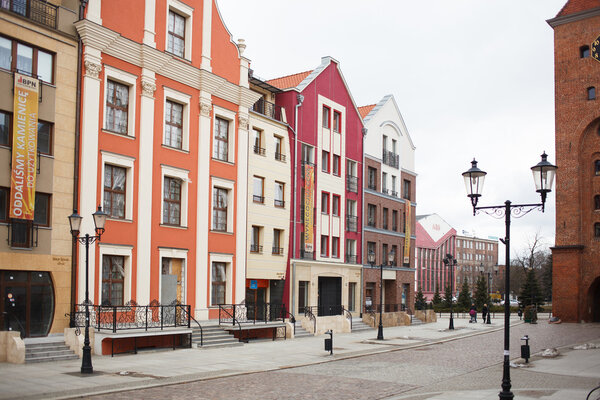 Elblag city, Poland, April 07 2013: View on the Market Gate and the main street of old town