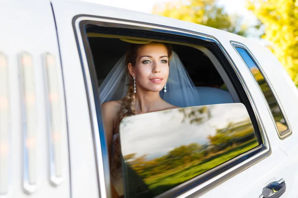 Bride in limousine — Stock Photo, Image