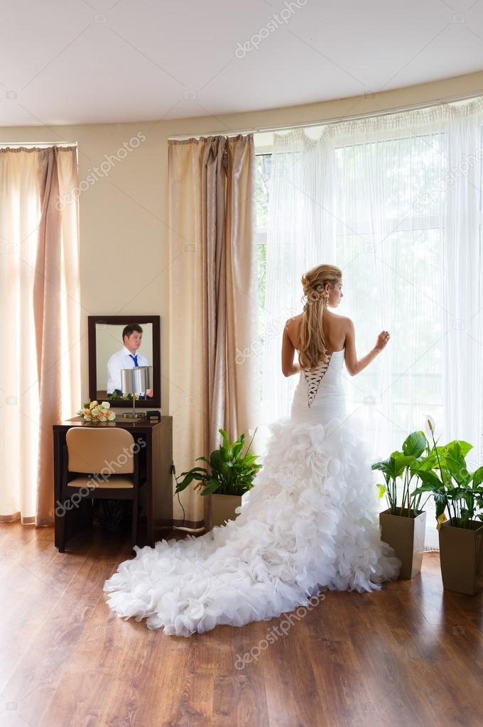 Bride and groom in a hotel room