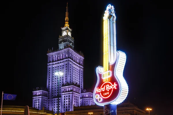 Palace of Culture and Science and advertising sign of Hard Rock Cafe — Zdjęcie stockowe