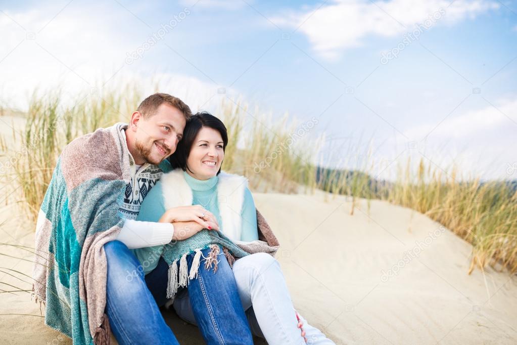 Happy couple in a dune