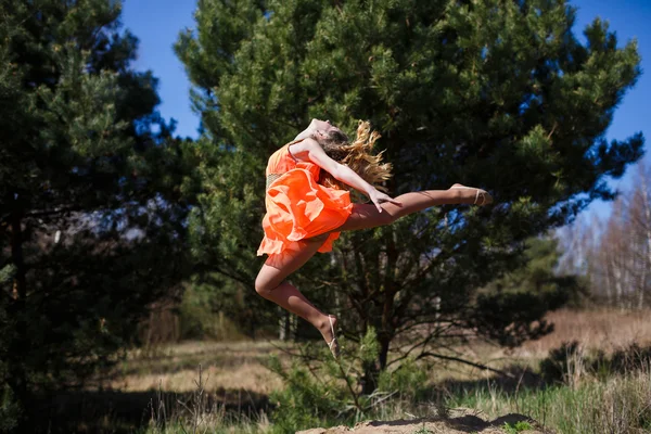 Young gymnast doing exercises