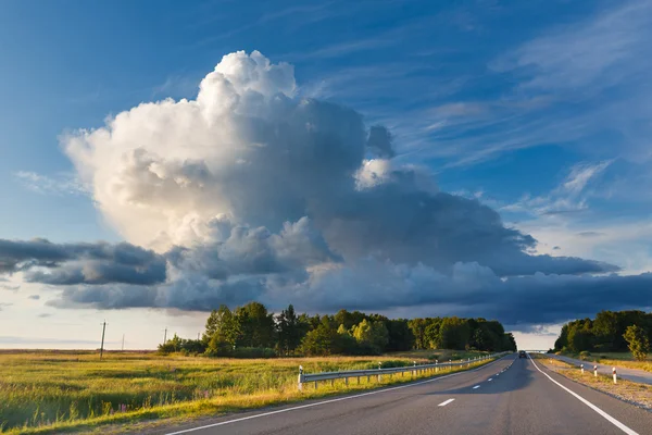 Big cloud above the highway — Stockfoto