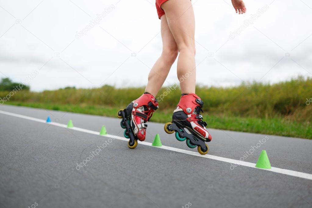 Legs of girl having roller skate exercise