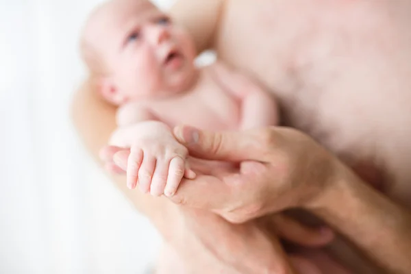 Father holding his one month old son — Stock Photo, Image