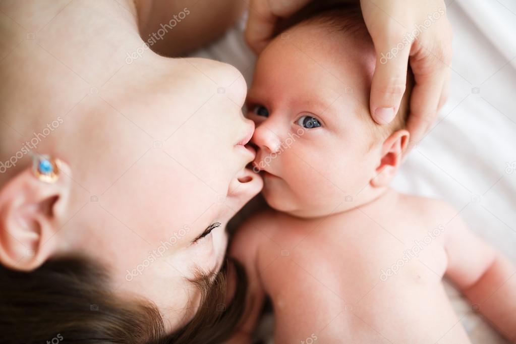 Mother and her one month old son close up