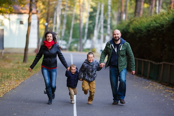 Happy family in fall — Stock Photo, Image