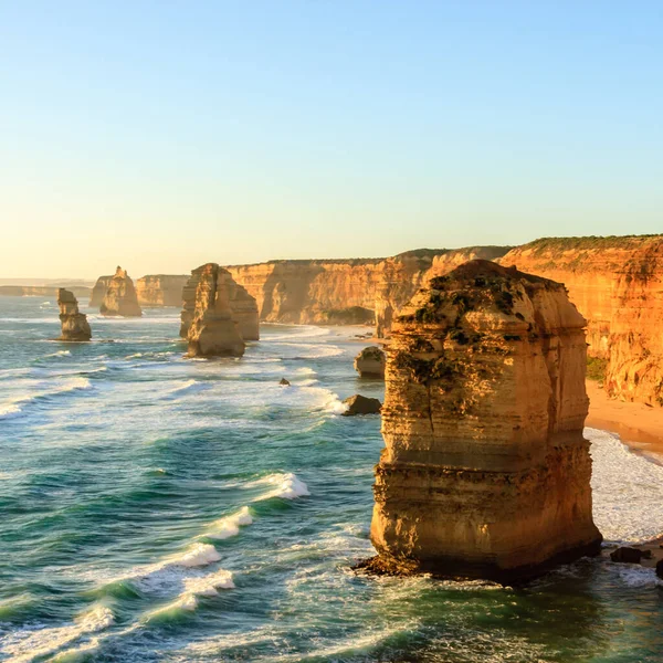 Blue ocean waves near Twelve Apostles Sea Rocks. Famous landmark near Great Ocean Road , Port Campbell National Park, Victoria Australia