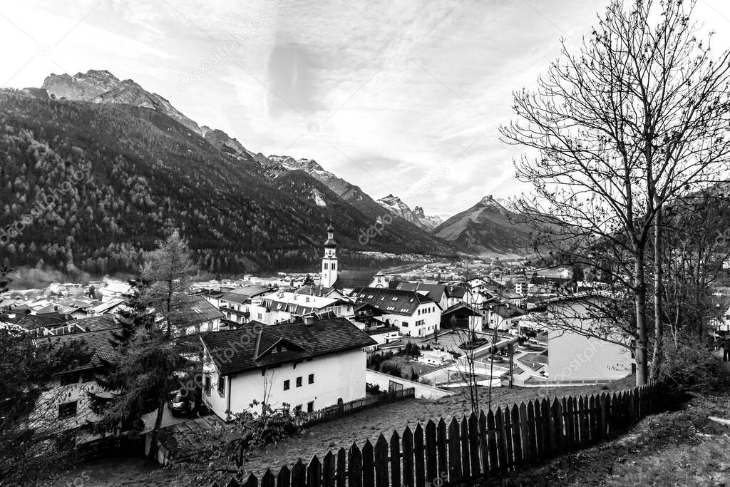 Black and white view of small town Fulpmes in the Alpine valley, Tirol, Austria.