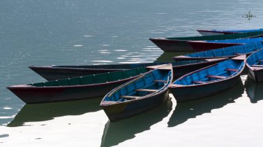 Wooden boats on the Phewa lake, Pokhara, Nepal