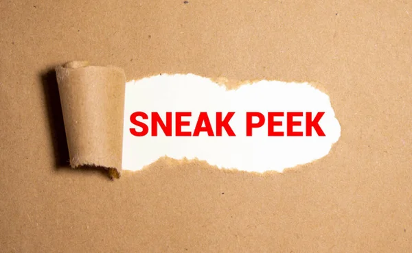 The phrase Sneak Peek appearing behind torn brown paper