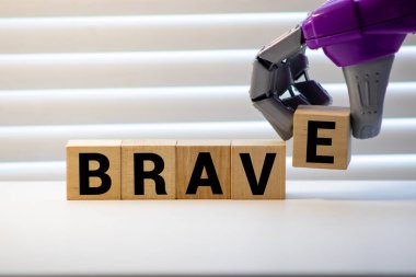 Işık arkaplanındaki yapı taşlarıyla yapılmış cesur sözcük