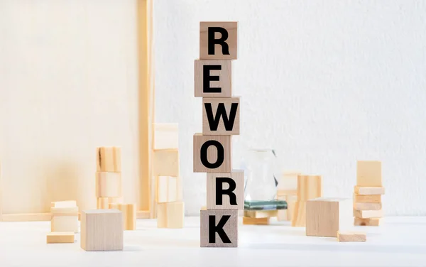 Alphabet letter block in word rework on wood background.