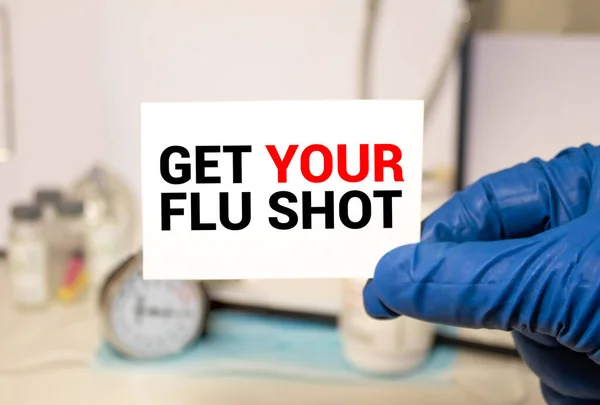 Get Your Flu Shot. card in hands of Medical Doctor.