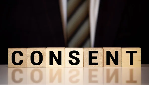 Consent word from wooden blocks on desk — Stock Photo, Image