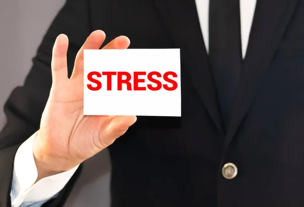 Affärsman Innehar Ett Kort Med Inskription Stress — Stockfoto