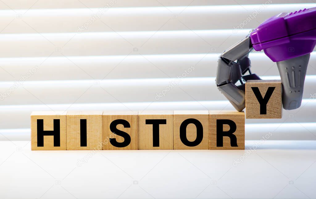 History - word from wooden blocks with letters, past events historical study Education concept, random letters around, white background
