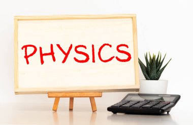 Tahta blok üzerine yazılmış PHYICS kelimesi, konsept