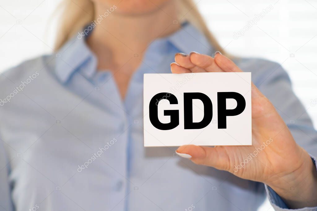 GDP or Gross Domestic Product letters on the card shown by a man.