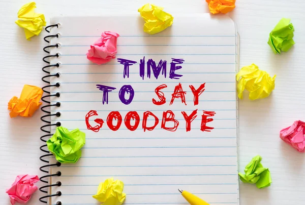 Time to Say Goodbye Text written on notebook page, red pencil on the right. Motivational Concept image.