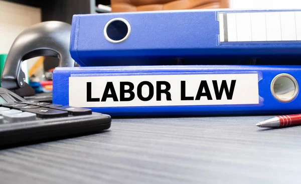 Folder with the label Labor Law, business concept