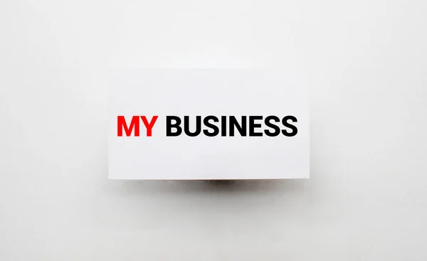 MY BUSINESS text written in a notebook lying on a wooden work table. Business concept. — Stock Photo, Image