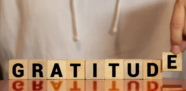 Gratitude word written on wood block. gratitude text on wooden table for your desing, concept. — Stock Photo, Image