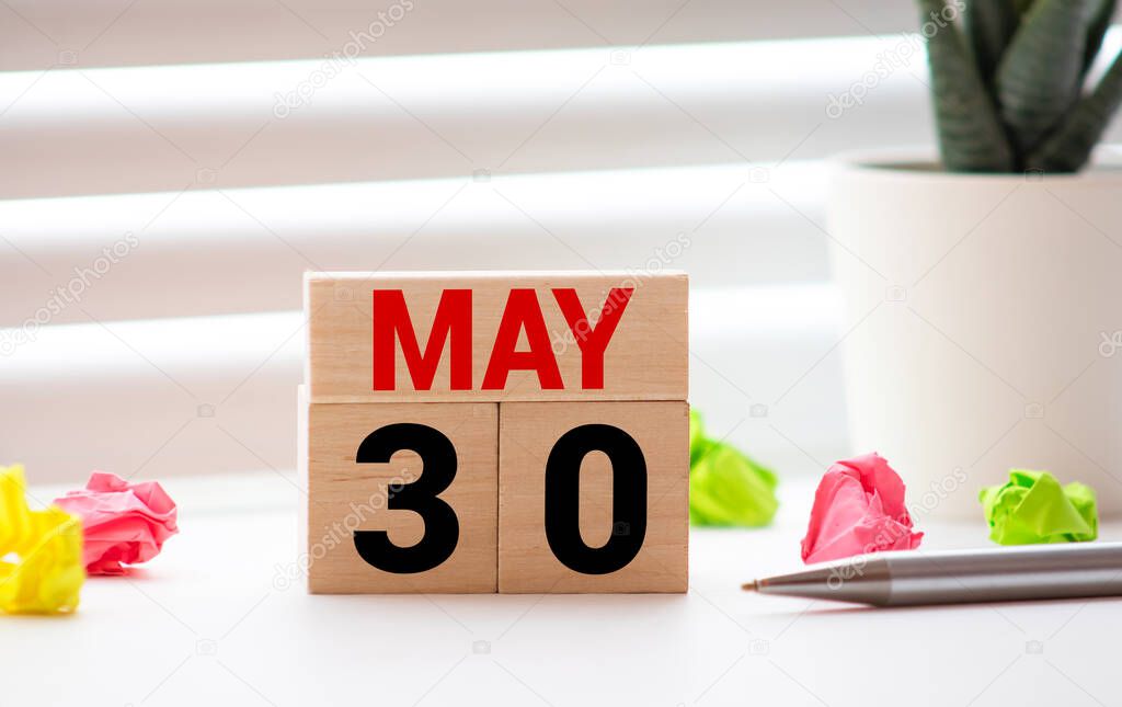 May 30th, Thirtieth of May, Day 30 of month May - vintage wooden white calendar blocks on black background with empty space for text
