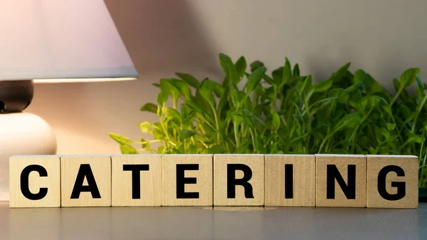 CATERING word made with building blocks.