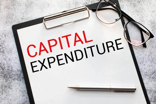 Text Kapitálové výdaje na bílou knihu, podnikatelská koncepce — Stock fotografie