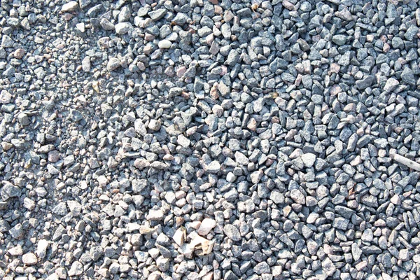 Gravel texture. Fine light gray stone gravel. Natural textural background.