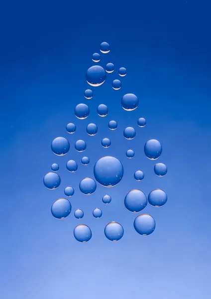 在蓝色背景上的水滴符号 — 图库照片
